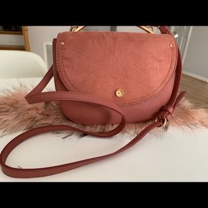 Pretty pink Lauren Conrad cat ears purse with long cross body strap